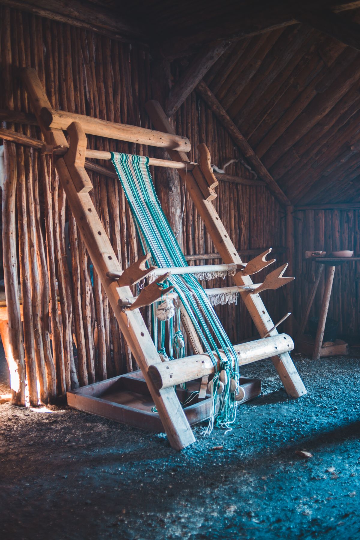 Textile loom weaving fabric in a mill